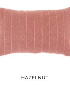 Hazelnut-colored rectangular pillow with vertical white stripes — eco-luxury decorative cushion for sustainable interiors.