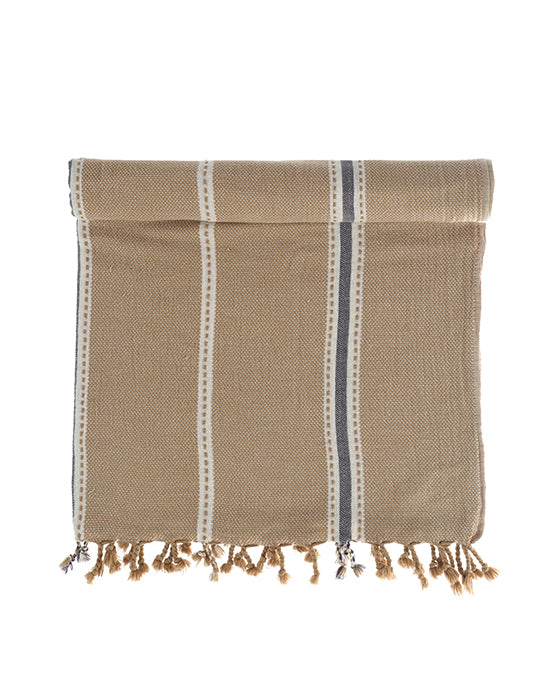 Folded beige Tulum 200 gram Aegean Cotton and Linen Turkish towel with white and navy stripes handcrafted from sustainable cotton by Minoa Home highlighting the softness and quality of an organic bath towel