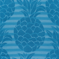 Tropical blue jacquard beach towel featuring bold pineapple patterns and horizontal stripes by Minoa Home.