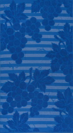 Blue jacquard beach towel by Minoa Home featuring vineyard grapevine pattern with bold stripes.