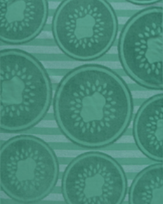 Fresh green jacquard beach towel with kiwi fruit slice pattern and striped background from Minoa Home.