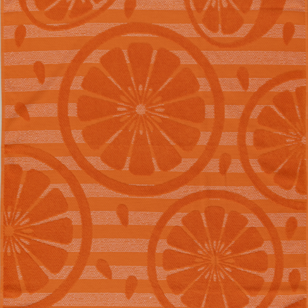 Bright orange jacquard beach towel with citrus slice pattern and striped background from Minoa Home