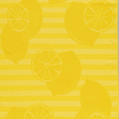 Bright yellow jacquard beach towel with lemon slice and whole fruit motifs on striped background by Minoa Home.