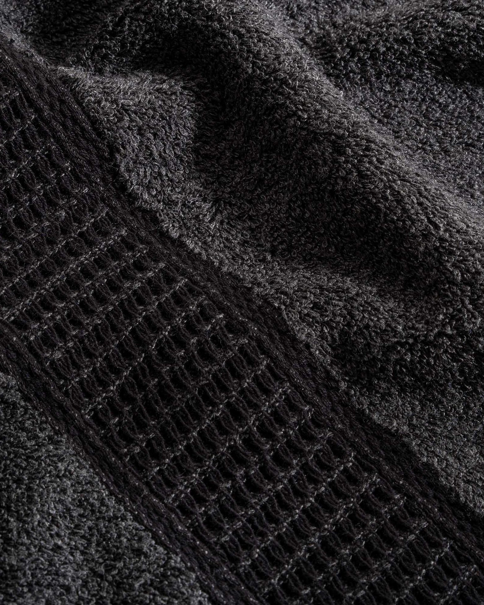 Close-up of Naia & Cotton luxury bath towel in Dark Pearl by Minoa USA Canada, showcasing soft texture, rich color, and premium quality fabric