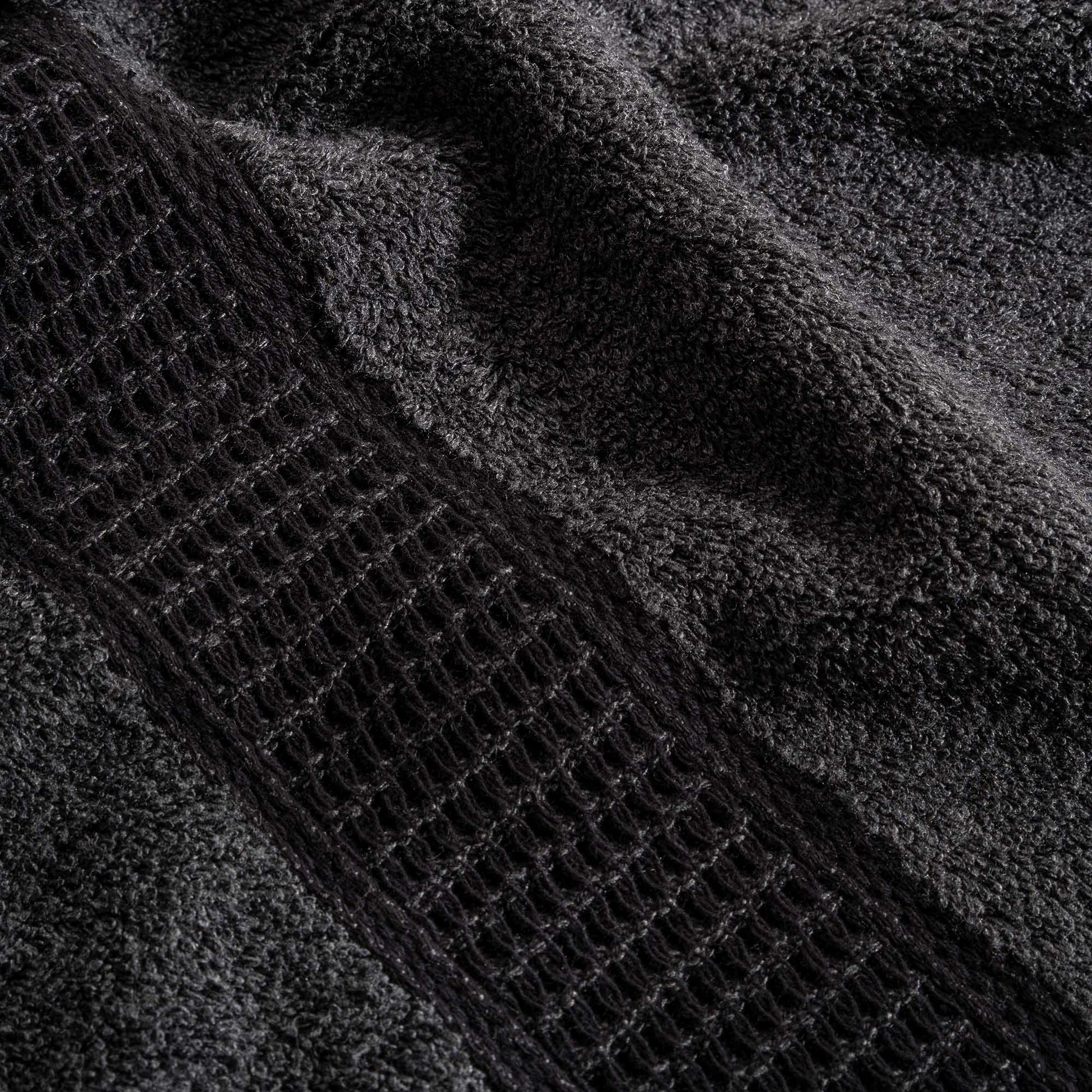 Close-up of Naia & Cotton luxury bath towel in Dark Pearl by Minoa USA Canada, showcasing soft texture, rich color, and premium quality fabric