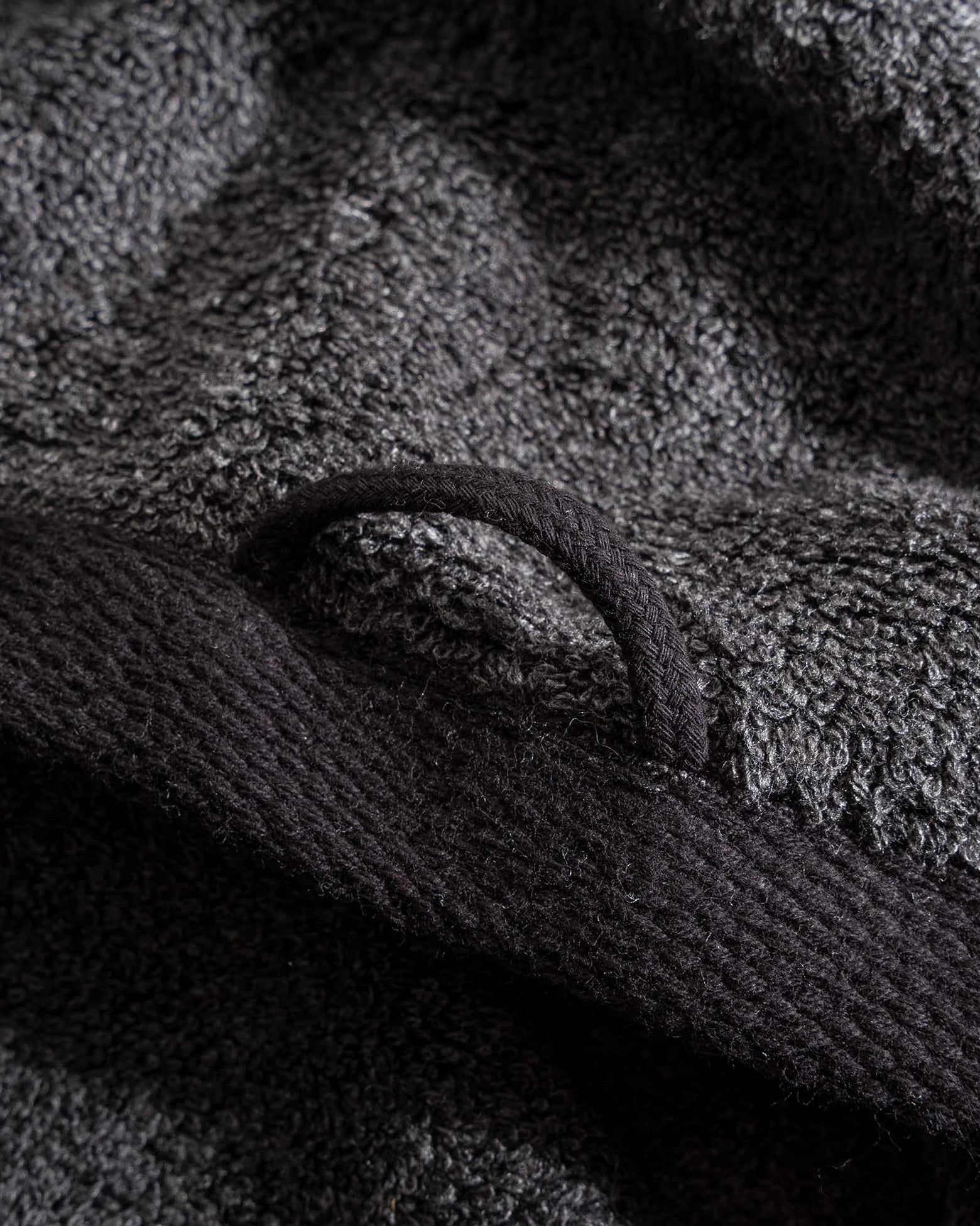 Naia & Cotton luxury bath towels in Dark Pearl by Minoa USA Canada, featuring a round loop for hanging and highlighting soft texture, elegant color, and premium fabric