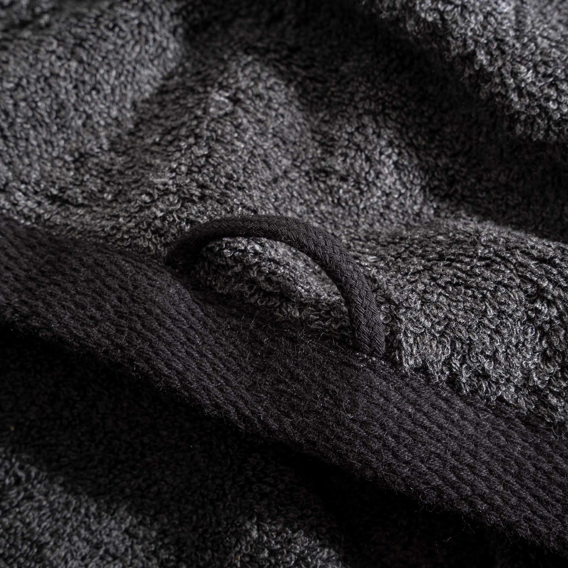 Naia & Cotton luxury bath towels in Dark Pearl by Minoa USA Canada, featuring a round loop for hanging and highlighting soft texture, elegant color, and premium fabric