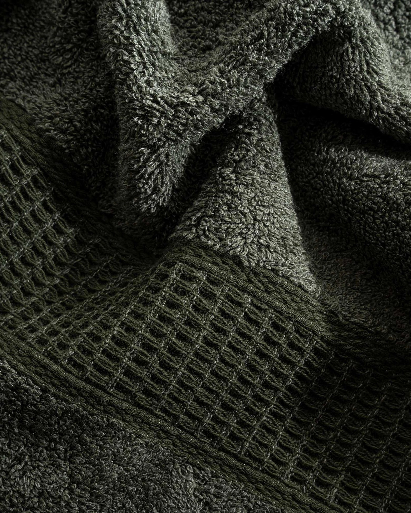 Close-up of Naia & Cotton luxury bath towel in Mossy Muse by Minoa USA Canada, showcasing soft texture, rich color, and premium quality fabric