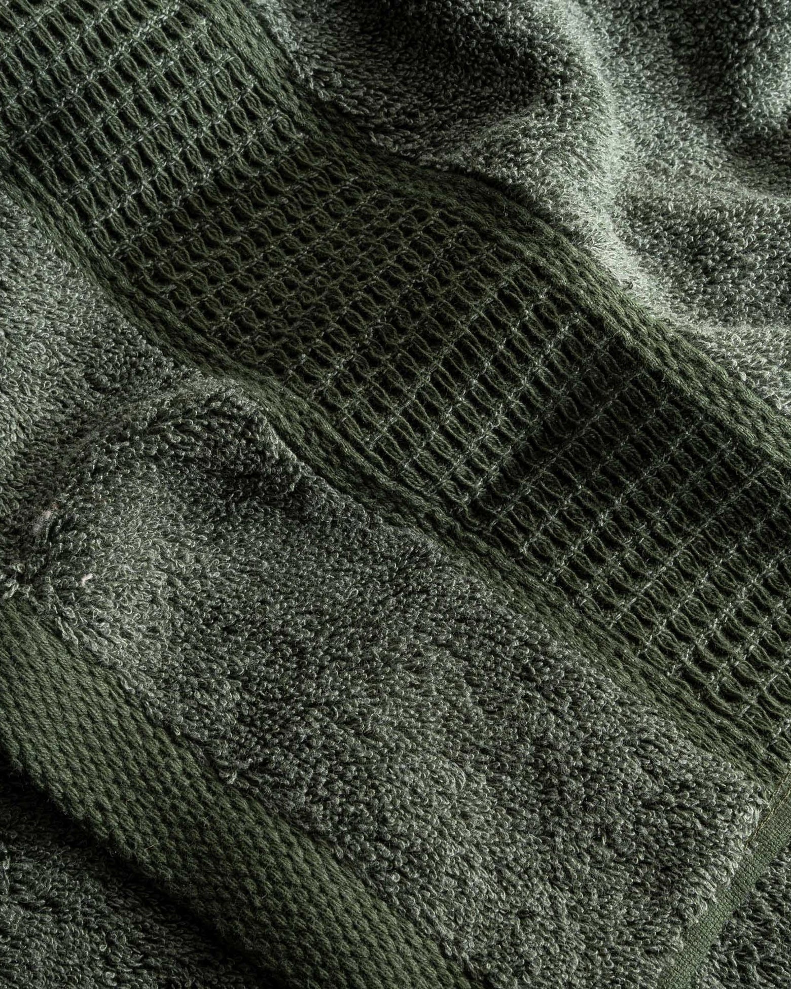 Close-up of the Naia & Cotton luxury Hand Towel in Mossy Muse, highlighting its soft texture, rich colour, and luxurious fabric