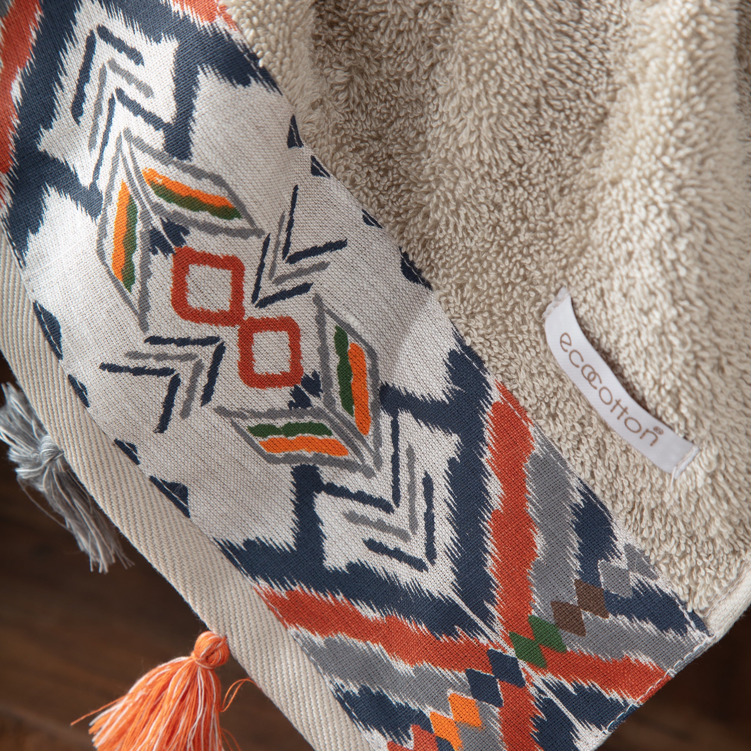 Pamira Organic Aegean Cotton Bath & Hand organic Towel Duo in Whispering Sands, with the Ecocotton tag, highlighting its soft texture, natural colour, and luxurious fabric