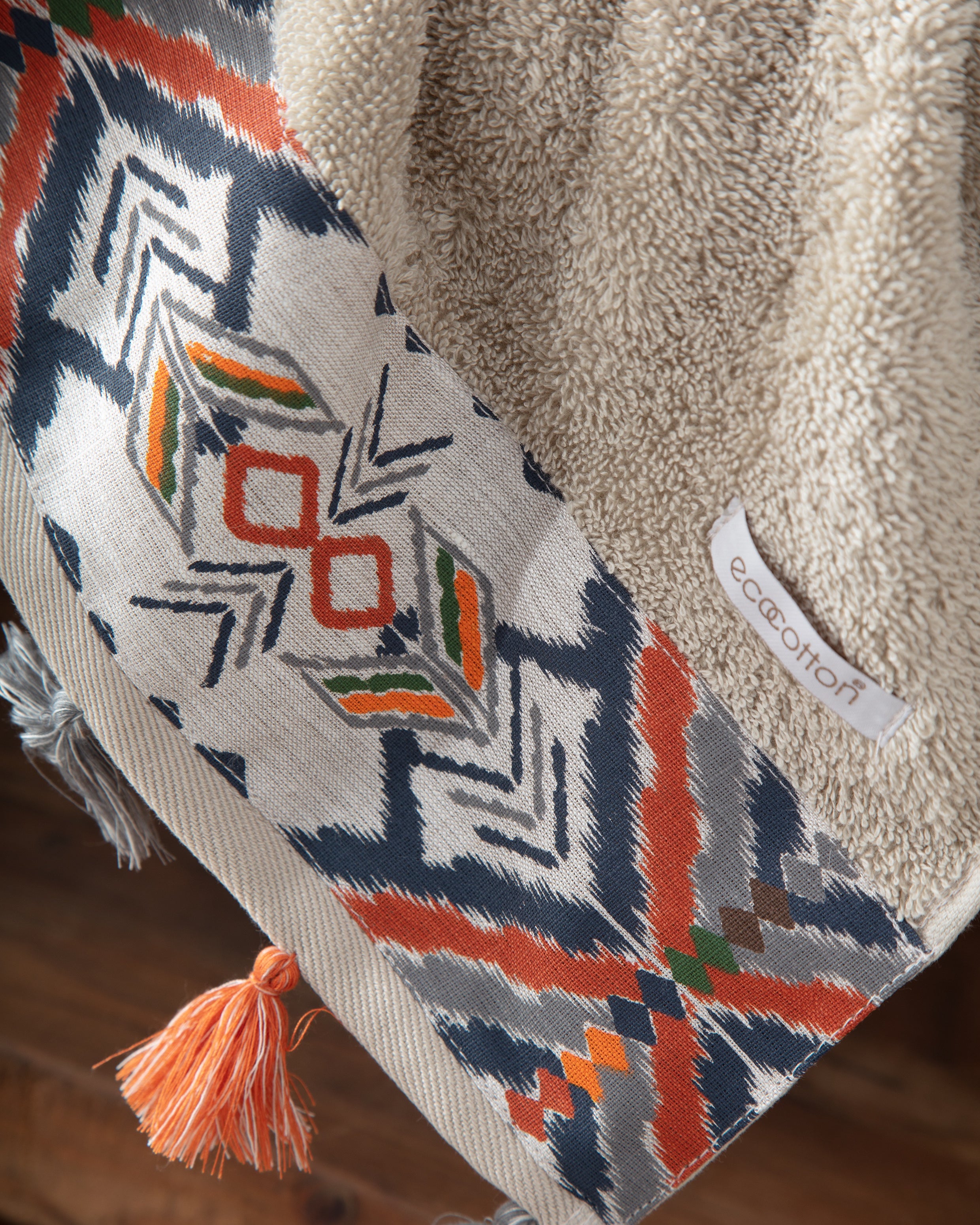 Pamira Organic Aegean Cotton Bath & Hand organic Towel Duo in Whispering Sands, with the Ecocotton tag, highlighting its soft texture, natural colour, and luxurious fabric