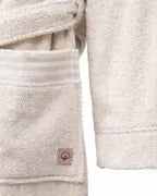Close-up of the long sleeve on Raisa Hemp & Organic Cotton Women’s robe, a sustainable luxury bath robe, showing its soft, textured fabric and natural finish.