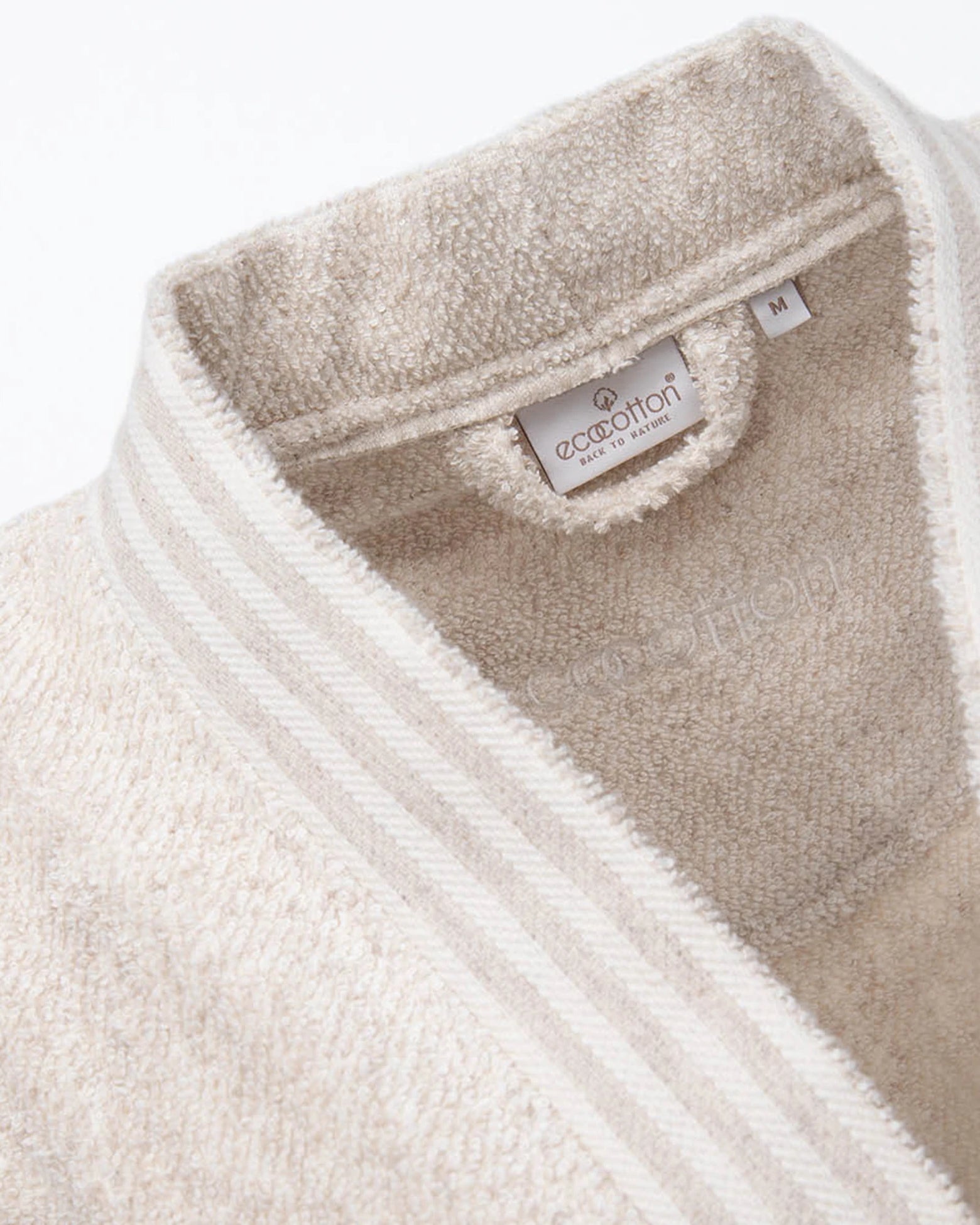 Close-up of EcoCotton tag on Raisa Hemp & Organic Cotton Women’s luxury bath robe, highlighting sustainable craftsmanship.