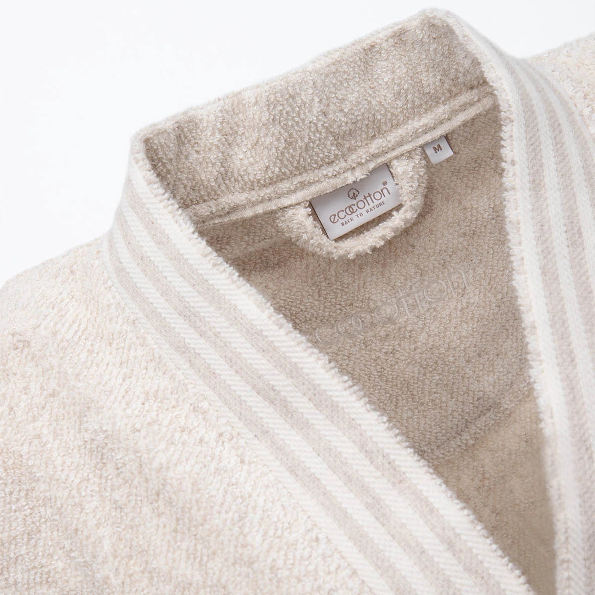 Close-up of EcoCotton tag on Raisa Hemp & Organic Cotton Women’s luxury bath robe, highlighting sustainable craftsmanship.