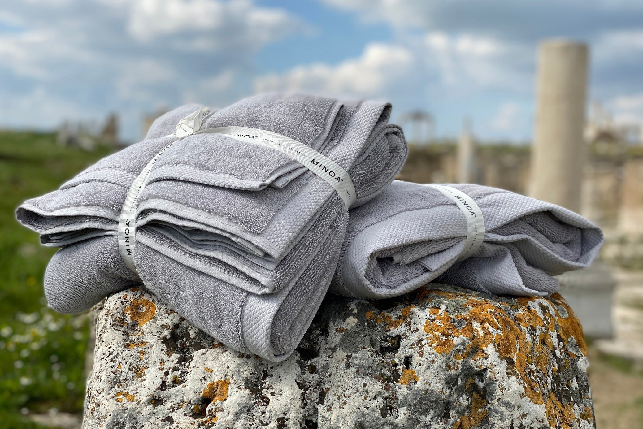 Two pieces of Minoa towel sitting on the rock