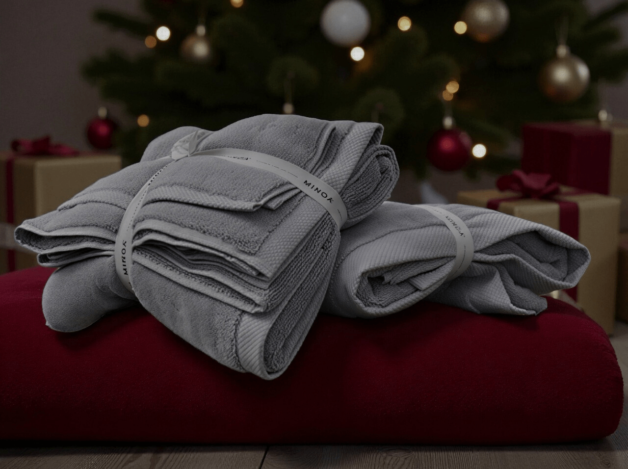 a hand selecting the pieces of large bath sheets from the closet