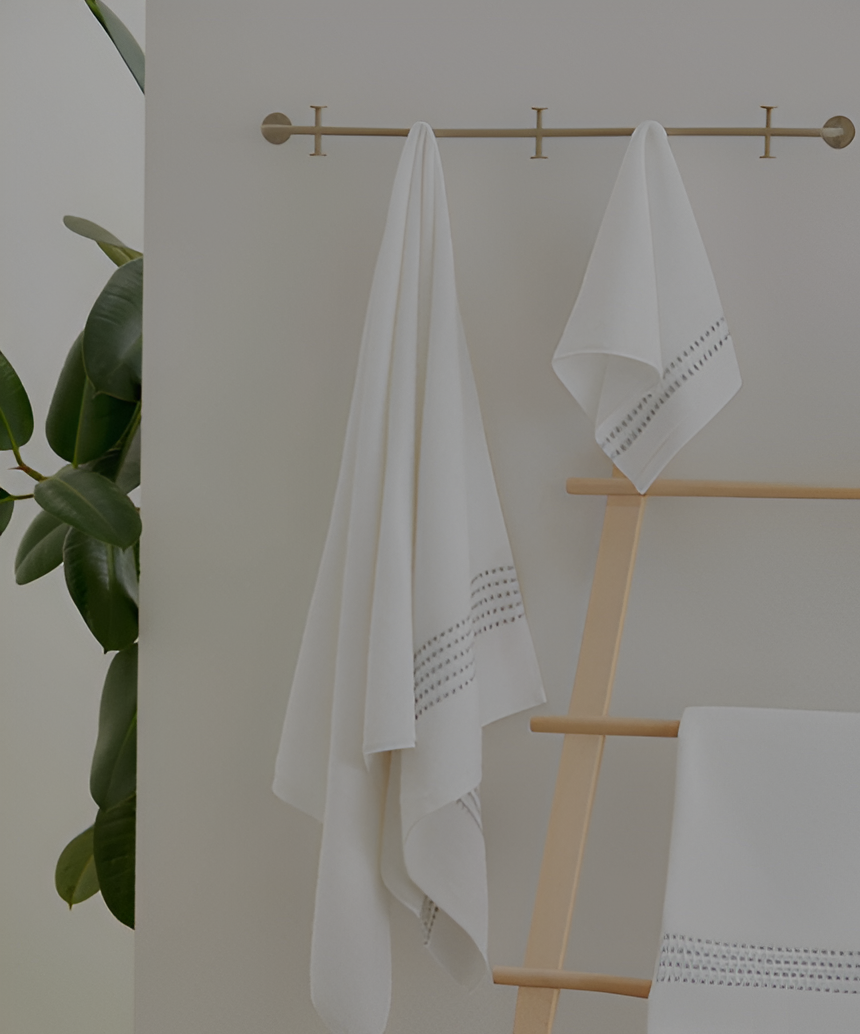 Collection of towels in varying sizes, made from organic Aegean cotton, offering luxurious softness and sustainability