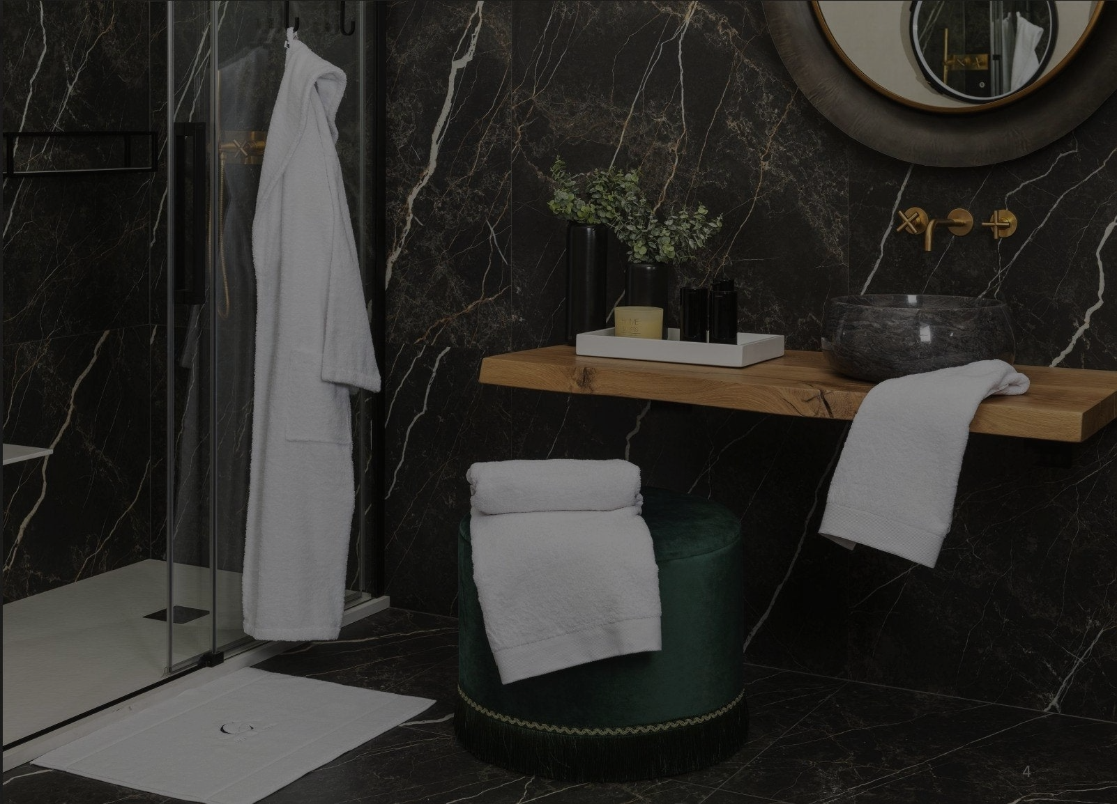 Soft, crinkled neutral-toned towels and linens artfully arranged in a woven basket with fresh greenery and natural accents, representing Minoa Home's cozy and eco-conscious bath and bedroom essentials."