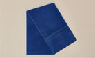 Front view of Sweat Blue gym towel, 100% cotton, 30x110 cm, with zipper pocket and antibacterial treatment