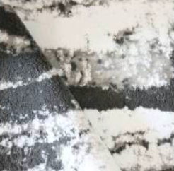 Stylish white bath rug with dark grey and silver highlights, delivering a bold and contemporary appearance for your bathroom space