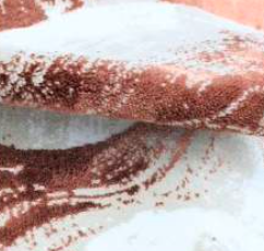 Delicate rose-colored bath rug in ecru and beige, offering a soft, feminine touch to your bathroom decor