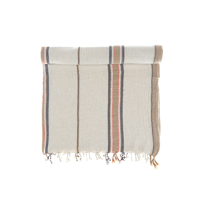Sand and Navy Elba Turkish Towel crafted from Aegean cotton and linen highlighting light texture and breathable design of organic and luxury bath tow