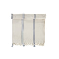 Beige towel with blue stripes and fringes on a white background