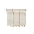Beige towel with brown stripes and fringes on a white background