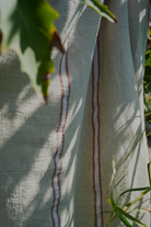 Natural eco friendly orange and white Anakao 215 gram Aegean Cotton and Linen Turkish towel highlighting its organic bath towel quality
