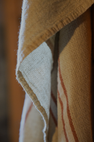 Luxuriously soft natural Anakao 215 gram Aegean Cotton and Linen Turkish towel hanging on the wall showcasing luxury bath towel quality