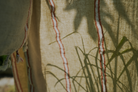 Close up of orange and white Anakao 215 gram Aegean Cotton and Linen Turkish towel showcasing its delicate texture and organic bath towel quality