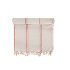 Textured towel with red stripes and frayed edges on a white background