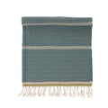 Towel with white stripes and fringes on a white background