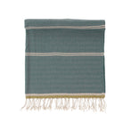 Towel with white stripes and fringes on a white background