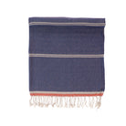 Blue towel with white and red stripes on a white background
