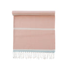 Pink towel with white stripes and fringes on a white background