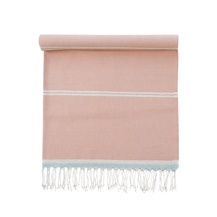 Pink towel with white stripes and fringes on a white background