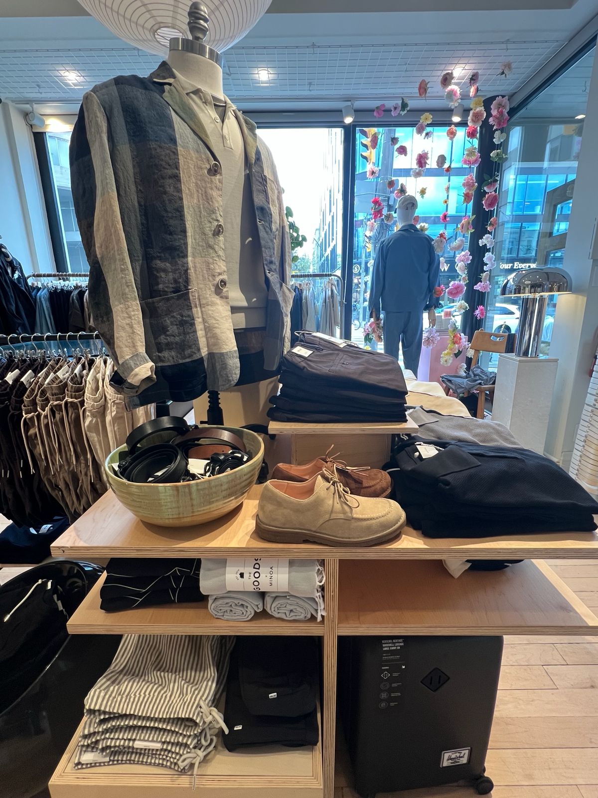 Mannequin with clothing and accessories in a store setting