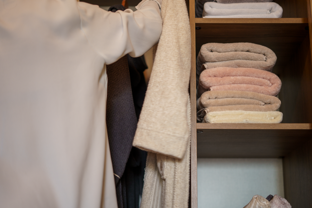 Monte Rosa 820-gram Aegean Cotton XL sheet set by Minoa USA Canada, neatly stacked on a wooden shelf, highlighting plush texture, natural elegance, and premium organic sheets quality