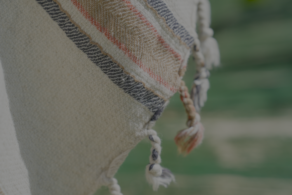 Close-up shot of organic baby blue and orange Elba Turkish towel crafted with sustainable materials

