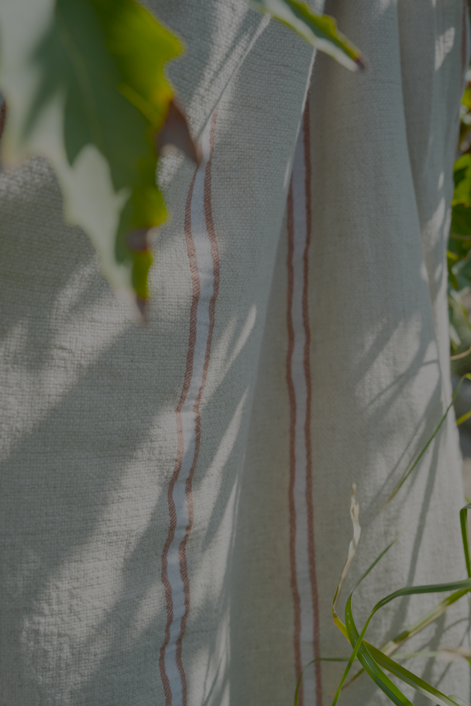 Natural eco friendly orange and white Anakao 215 gram Aegean Cotton and Linen Turkish towel highlighting its organic bath towel quality