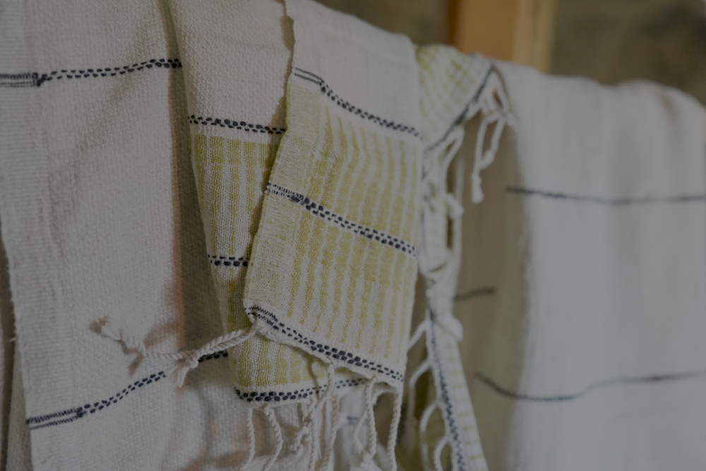 A close up shot of green version Palawan 220-gram Linen Hand Towel showcasing fabulous, luxuriously soft texture