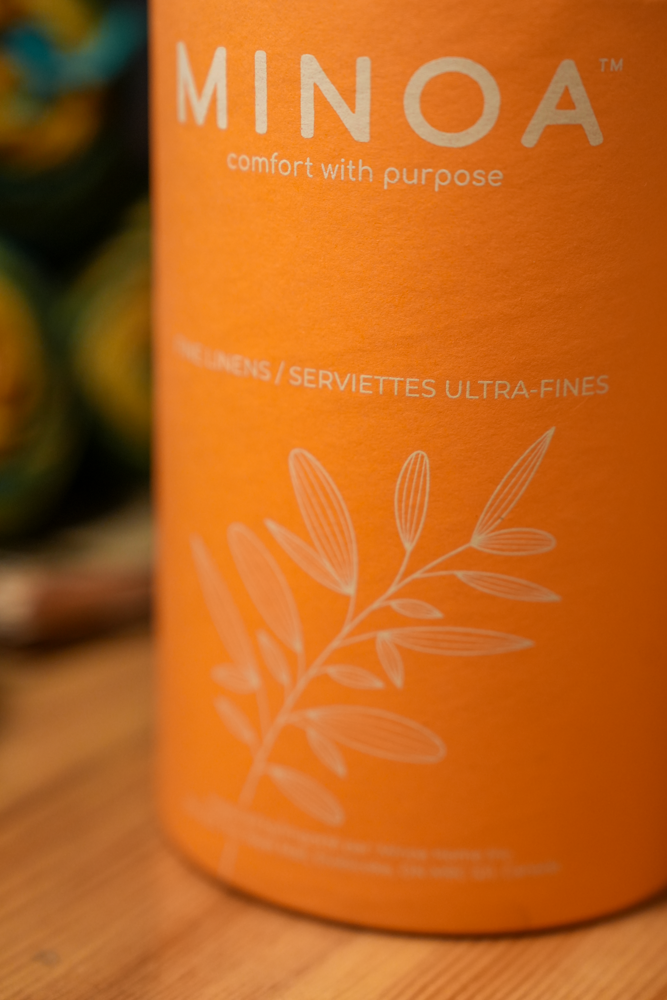 Plush Lite 500-Gram Aegean Cotton Guest Bath and Hand Towel Set elegantly presented in luxury Orange cylinder case