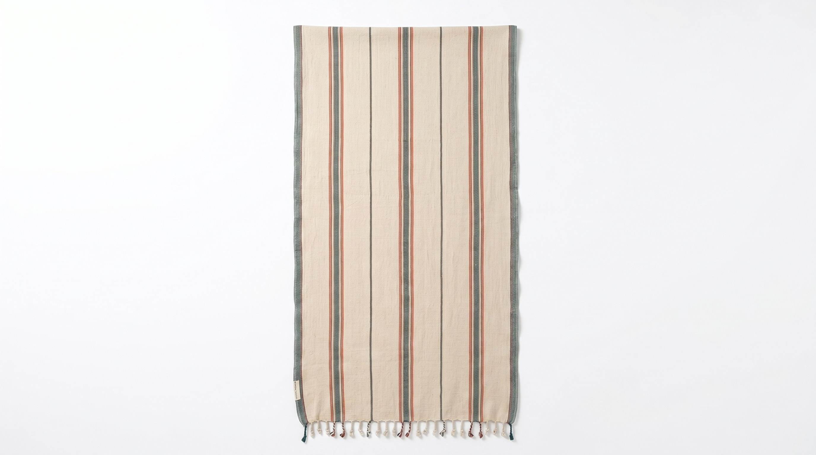 A vertical rectangular beige woven towel featuring thick sage green and thin rust-orange vertical stripes, finished with braided fringe along the bottom hem.