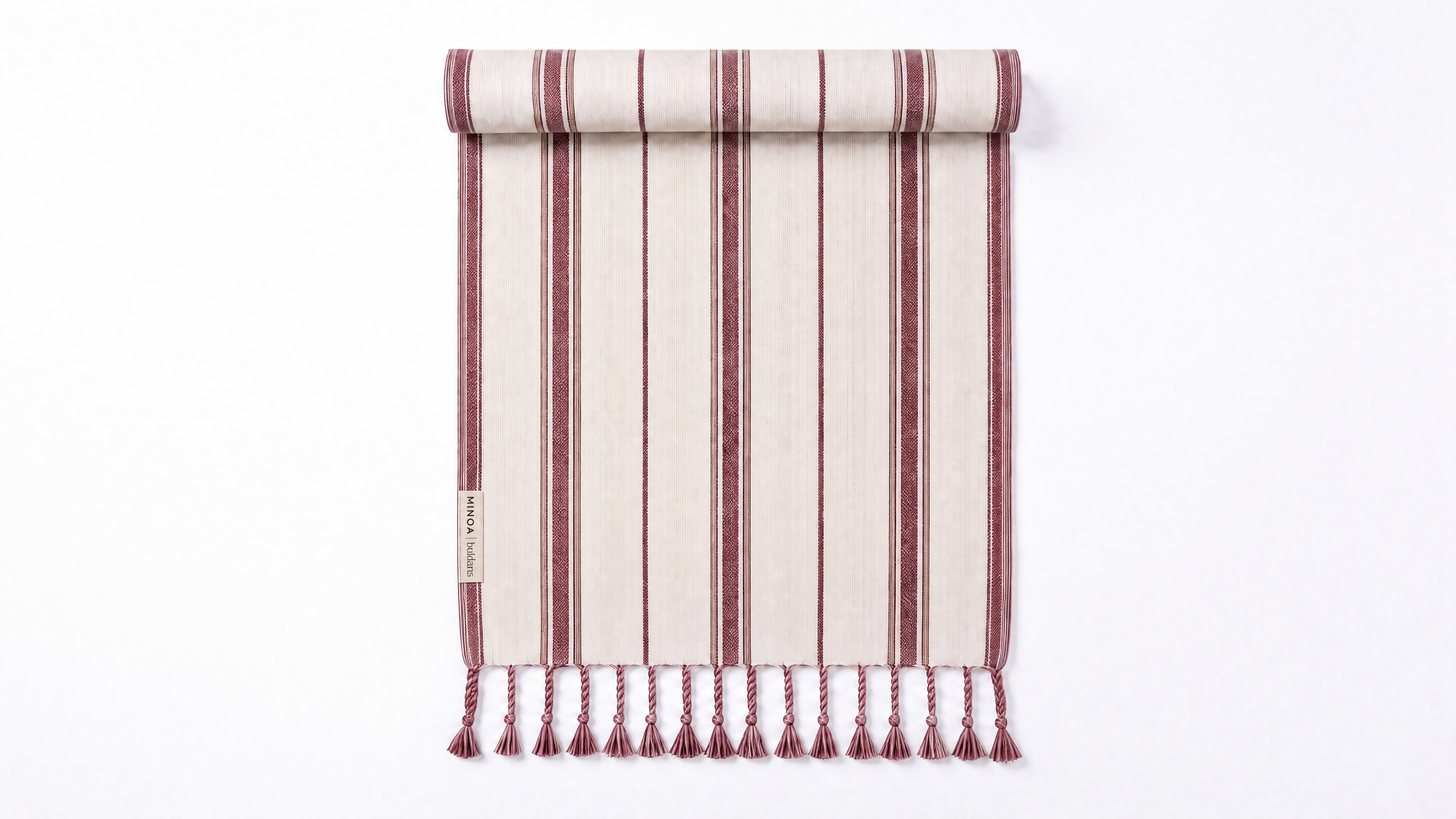A rolled-up striped towel with fringe tassels at the bottom, shown on a clean white background. The fabric features vertical stripes in dusty rose, cream, and dark brown, with a small woven label on the left side.