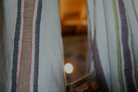 Two luxury organic Elba Turkish towels supporting circular economy hanging on a cloth hanger
