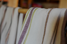 Two organic luxury bath towels from the Elba Turkish collection hanging on the same cloth hanger
