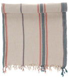 Striped towel with fringes on a white background