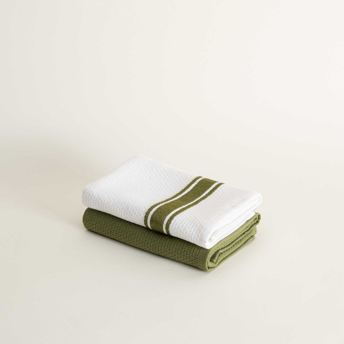 Elvin Organic Aegean Cotton Kitchen Towel set of 2 in Olive Oasis, neatly folded, showcasing its earthy colour and soft, luxurious texture