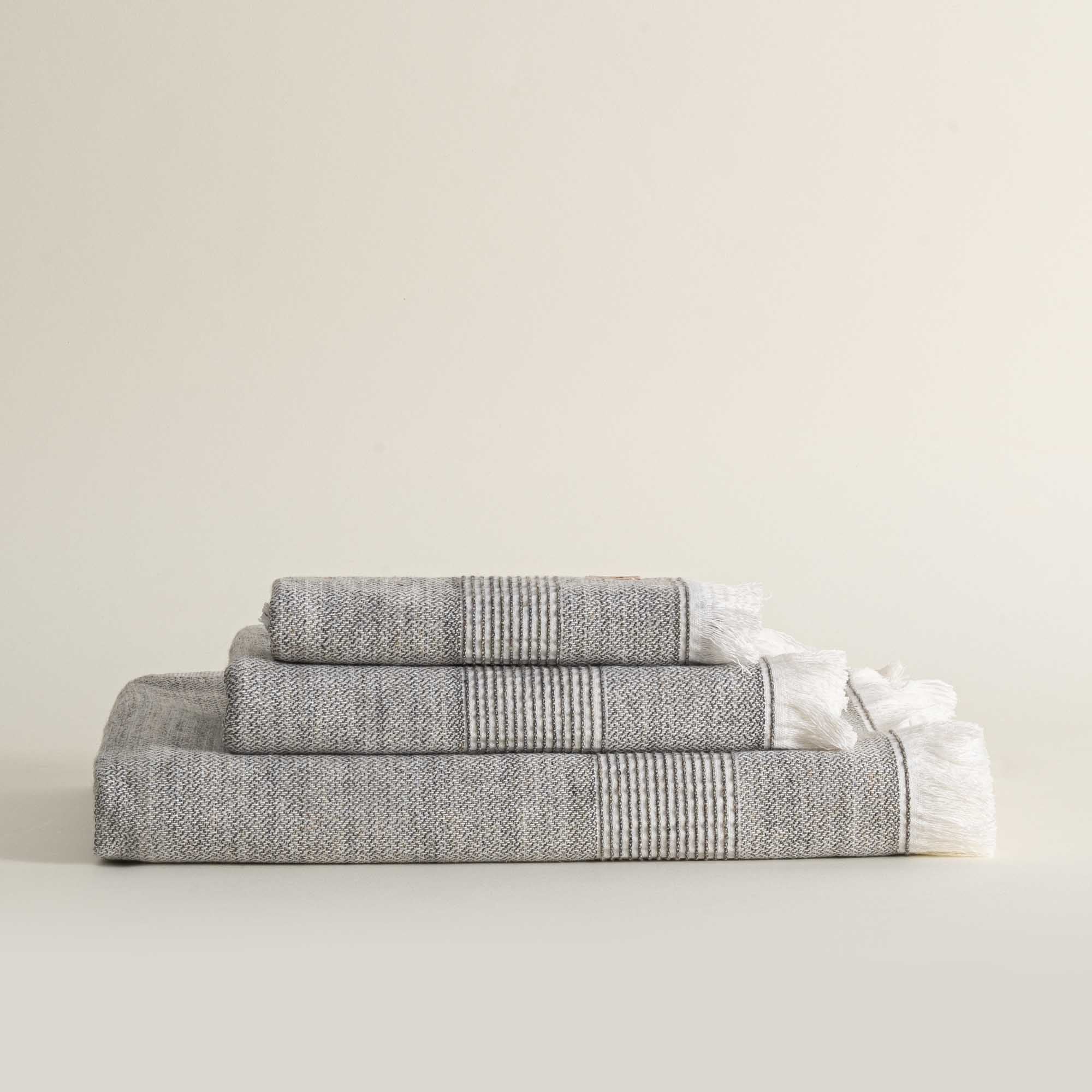 Front view of the three-piece Hasna Organic Aegean Cotton and Linen Bath Set in Grey Haze, neatly displayed to show the full size and subtle colour of each towel